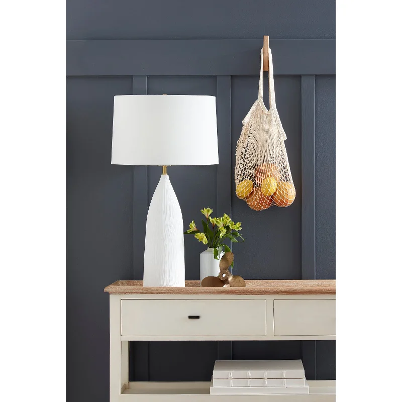 metal table lamps with a matte black finish for a sleek appearancemetal table lamps with a matte black finish for a sleek appearanceCoastal Living Hayden Ceramic Table Lamp By Regina Andrew